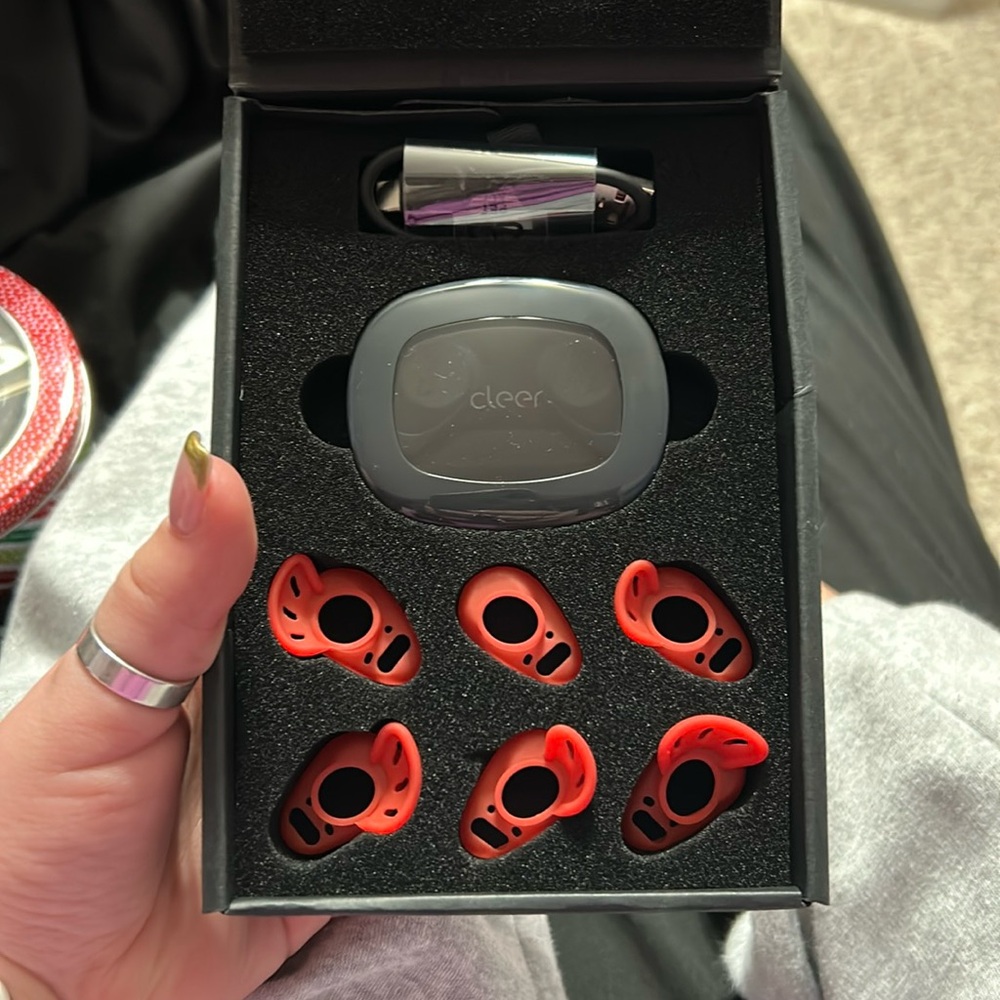Red/Black earpods with charging case and 4 different size options. NEVER USED